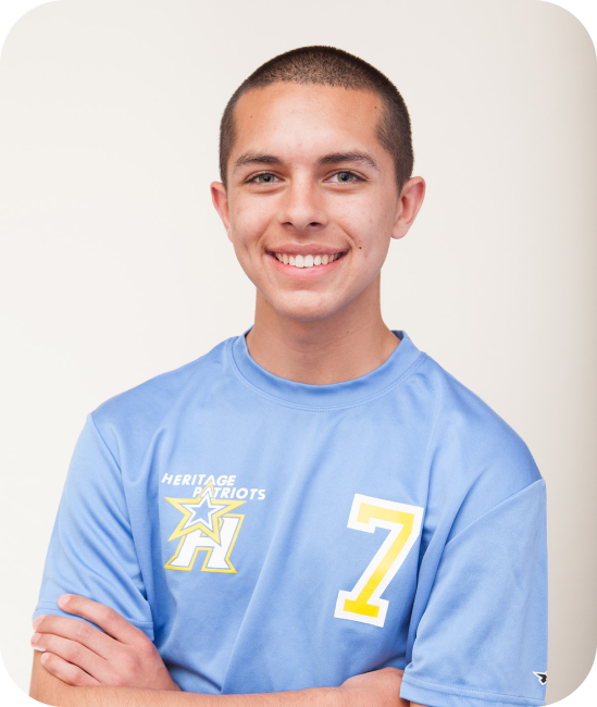 smiling teenage boy wearing a blue shirt