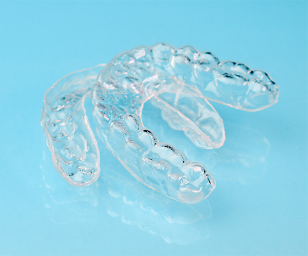 Clear Aligners On A Blue Background