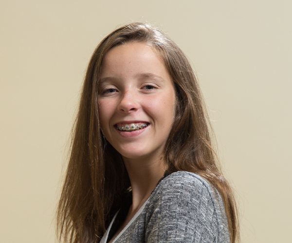 Young girl with braces smiling at Sheffield & Le Orthodontics