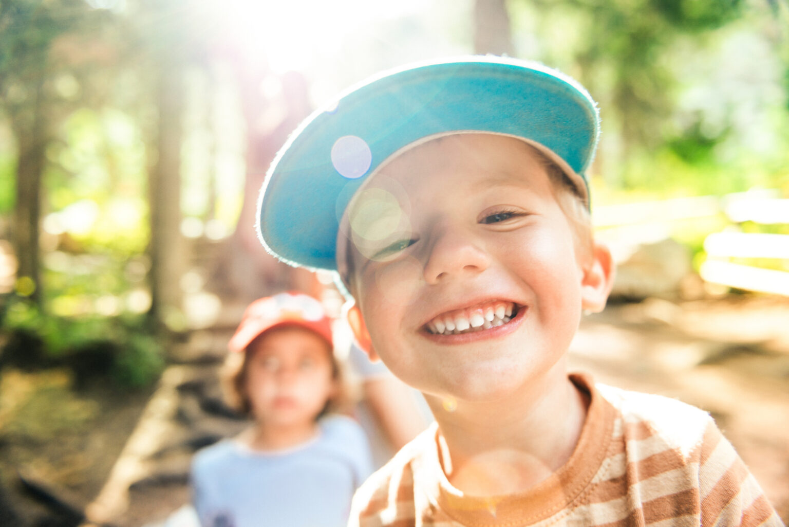 Little Boy Smiling at the camera in Campground
