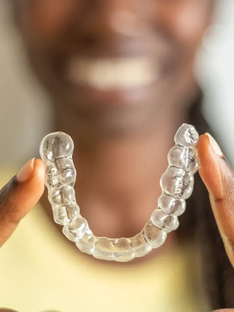 Woman Holding Invisalign